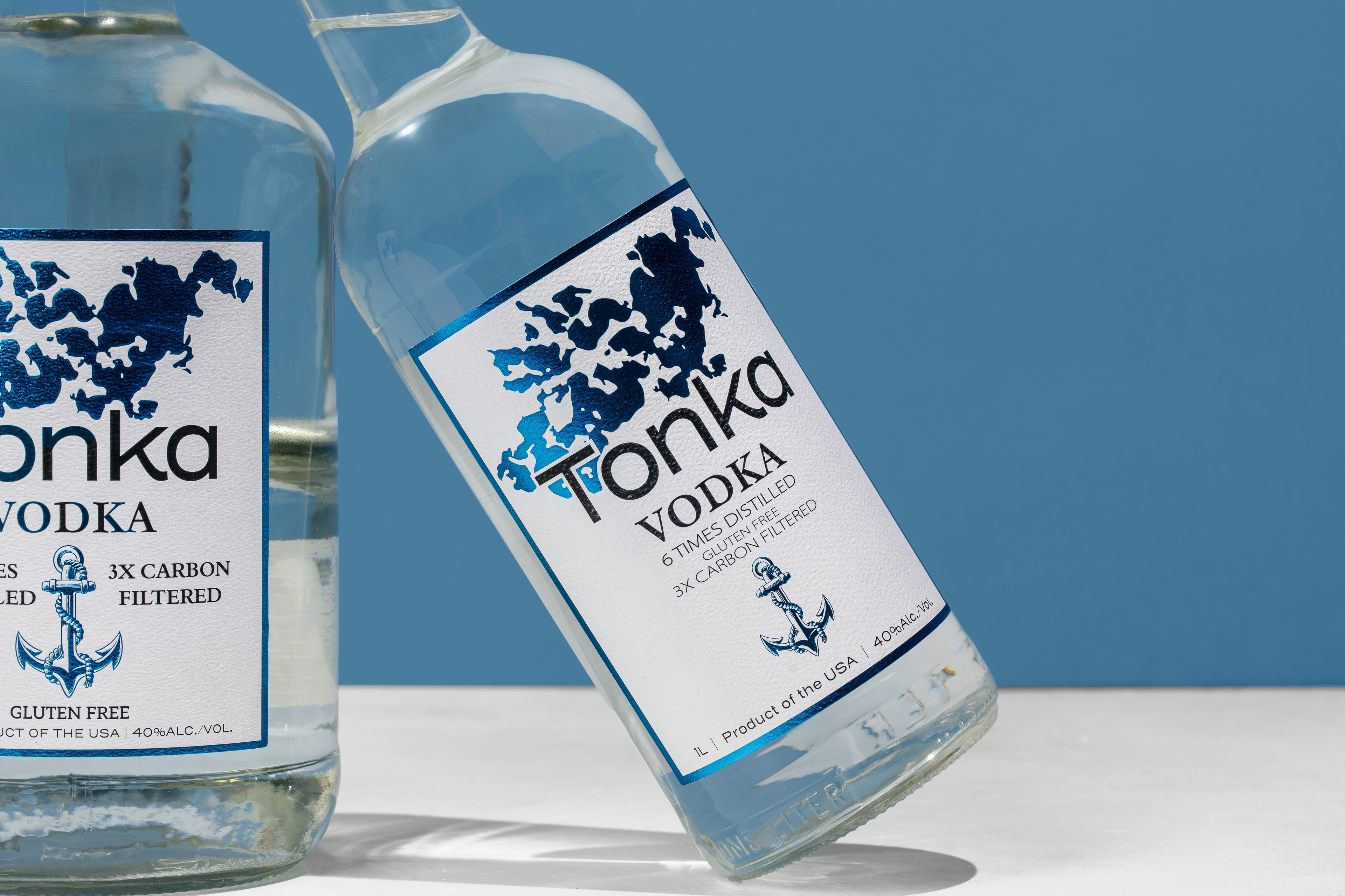 Friends enjoying Tonka Vodka cocktails by the lake